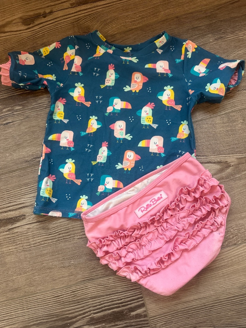 Ruffle Butts Navy Toucan Rashguard Set with Pink Bottoms